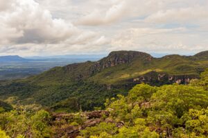 A beautiful vista of green mountains under a cloudy sky, showcasing natural beauty.