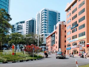 Vibrant cityscape of Kigali showcasing modern high-rise buildings on a sunny day.