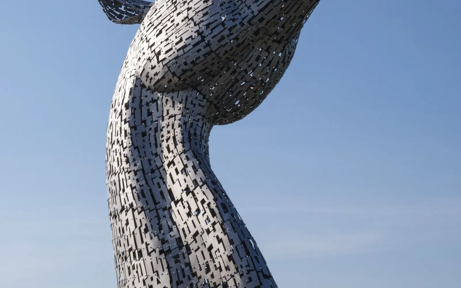 The Kelpies sculpture in Falkirk under a blue sky, illustrating a guide to farm shops in Falkirk