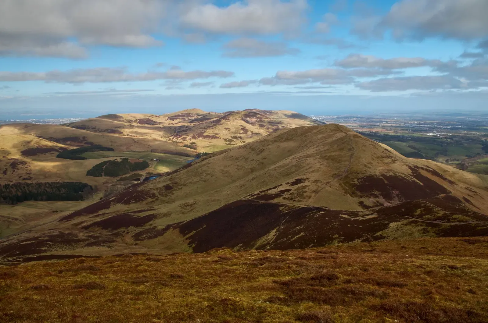 The Pentland Hills near Edinburgh on a clear day, edging the farms of Midlothian