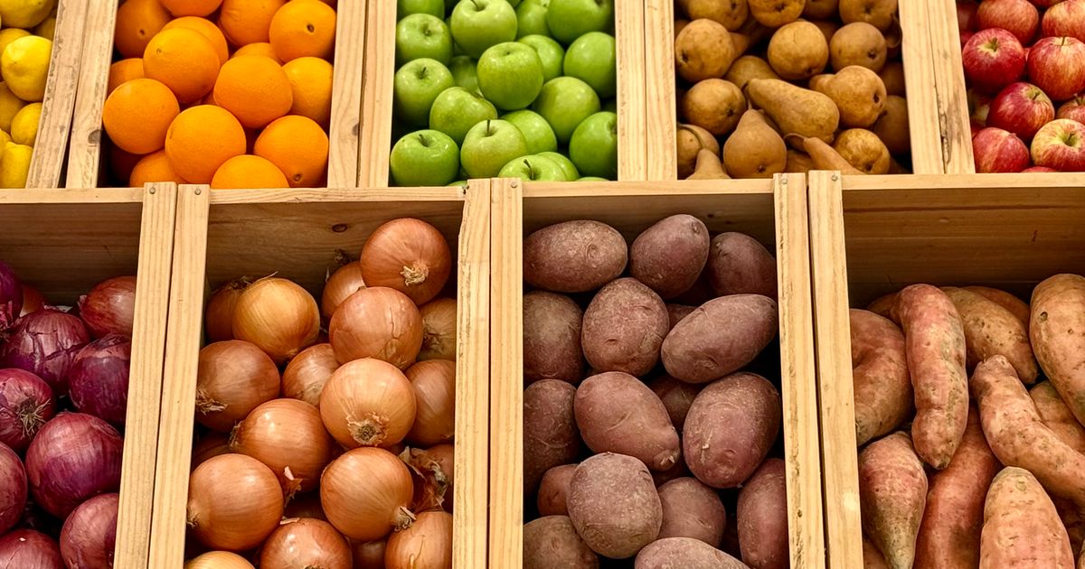 Fresh fruit and vegetables in wooden produce boxes