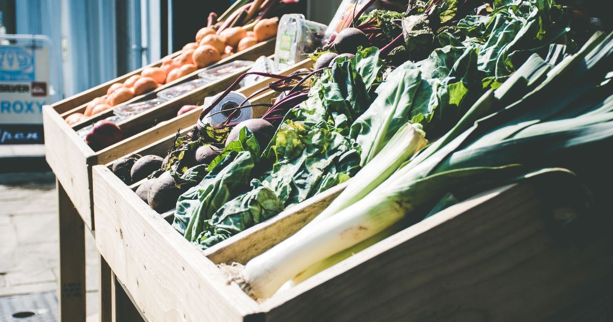 Fresh vegetables displayed at an outdoor produce stall